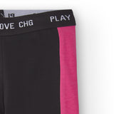 detalle del tejido elástico y la cinturilla del legging negro niña