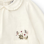 Camisa de bebé en color crudo con detalles de flores Charanga