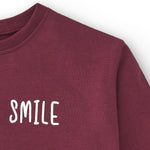 Camiseta de bebé básica en color burdeos smile Charanga