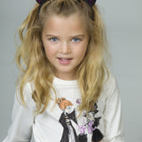 Camiseta de niña en color crudo con dibujo de brujas Charanga