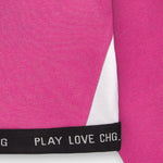 detalle banda inferior top deportivo niña fucsia