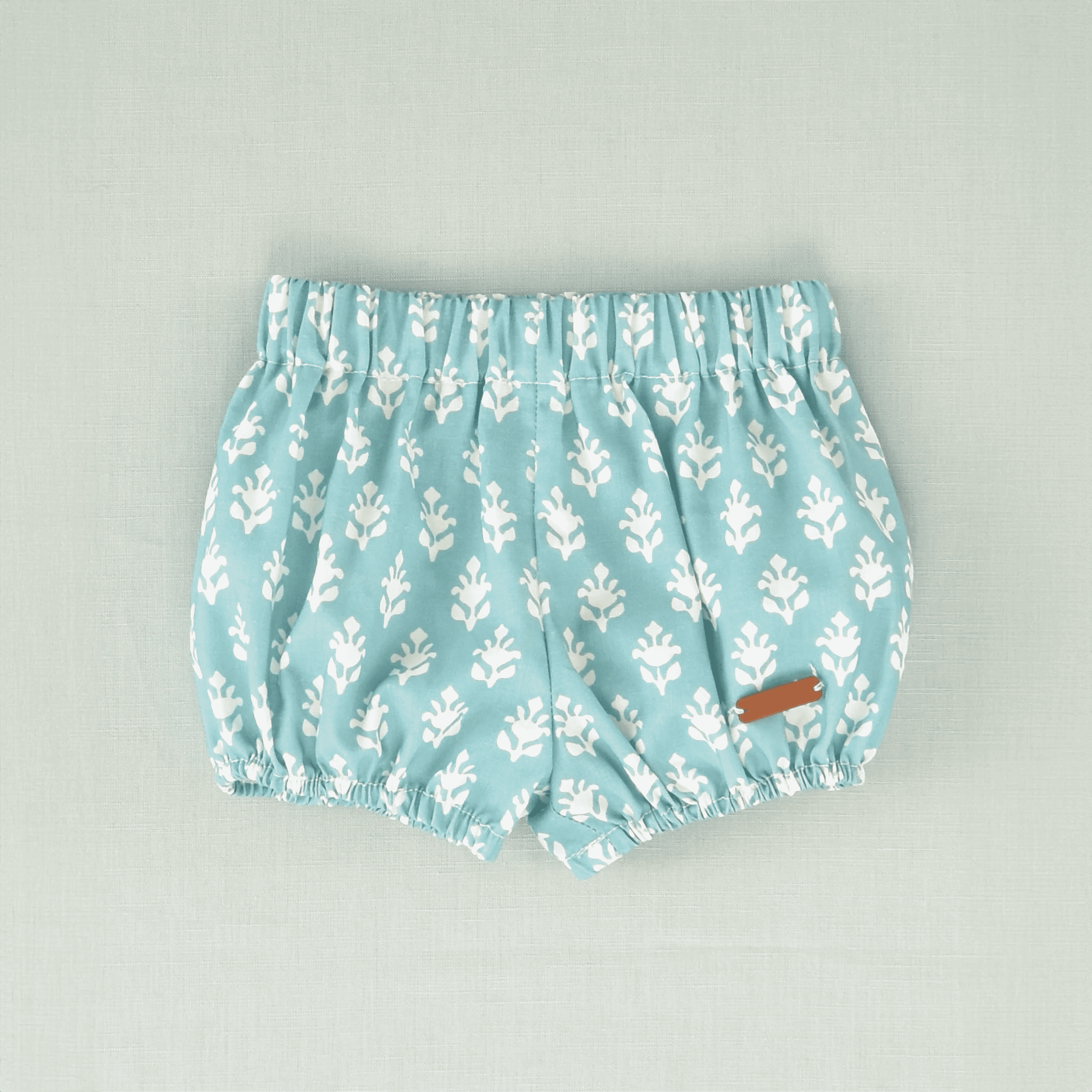 Braguita flores turquesa bebé niño