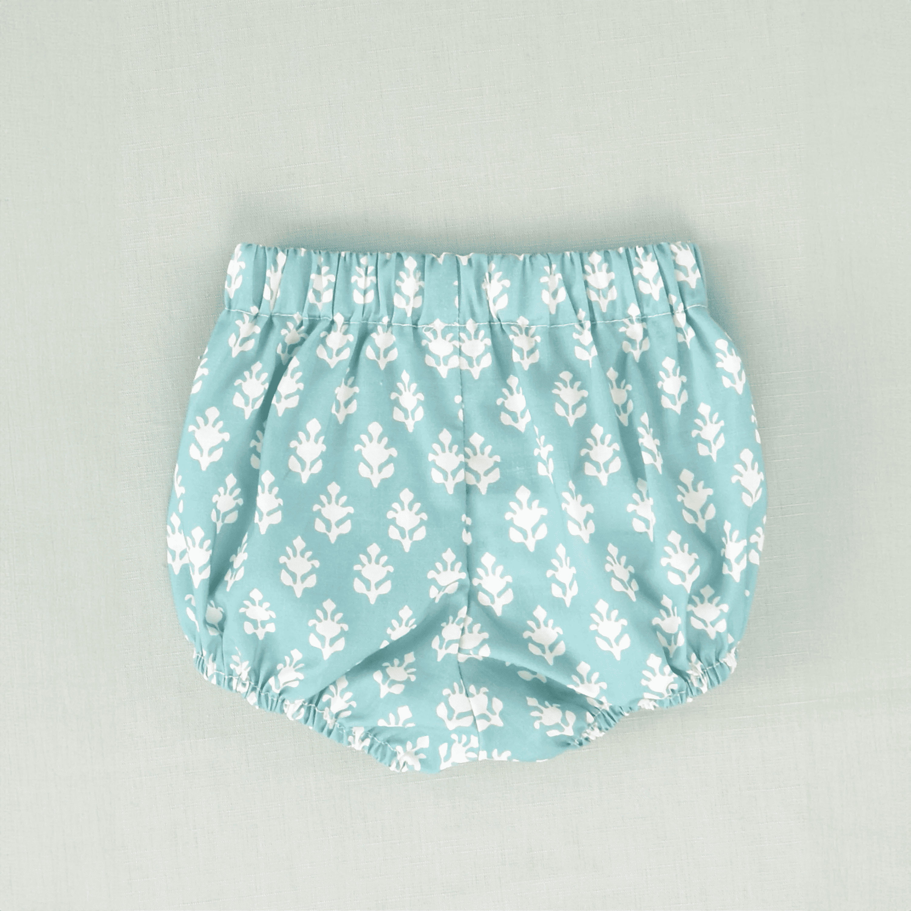 Braguita flores turquesa bebé niño