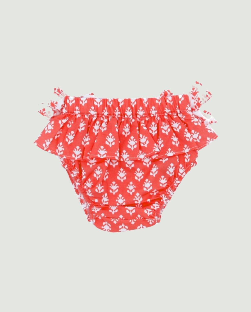 Braguita coral lazos bebé niña