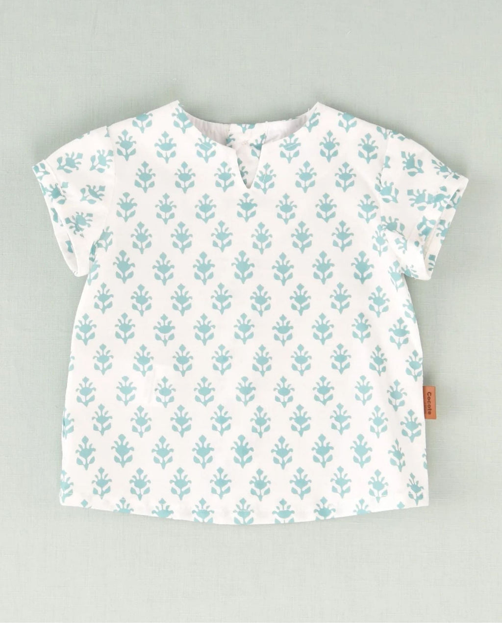 Camisa de flores blanca y turquesa bebé niño