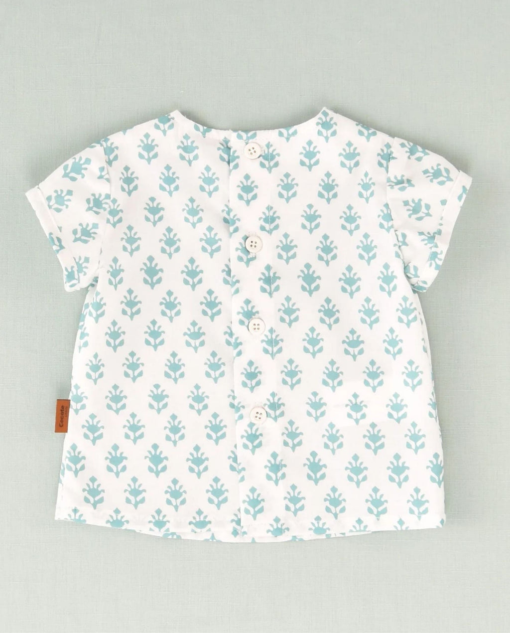Camisa de flores blanca y turquesa bebé niño