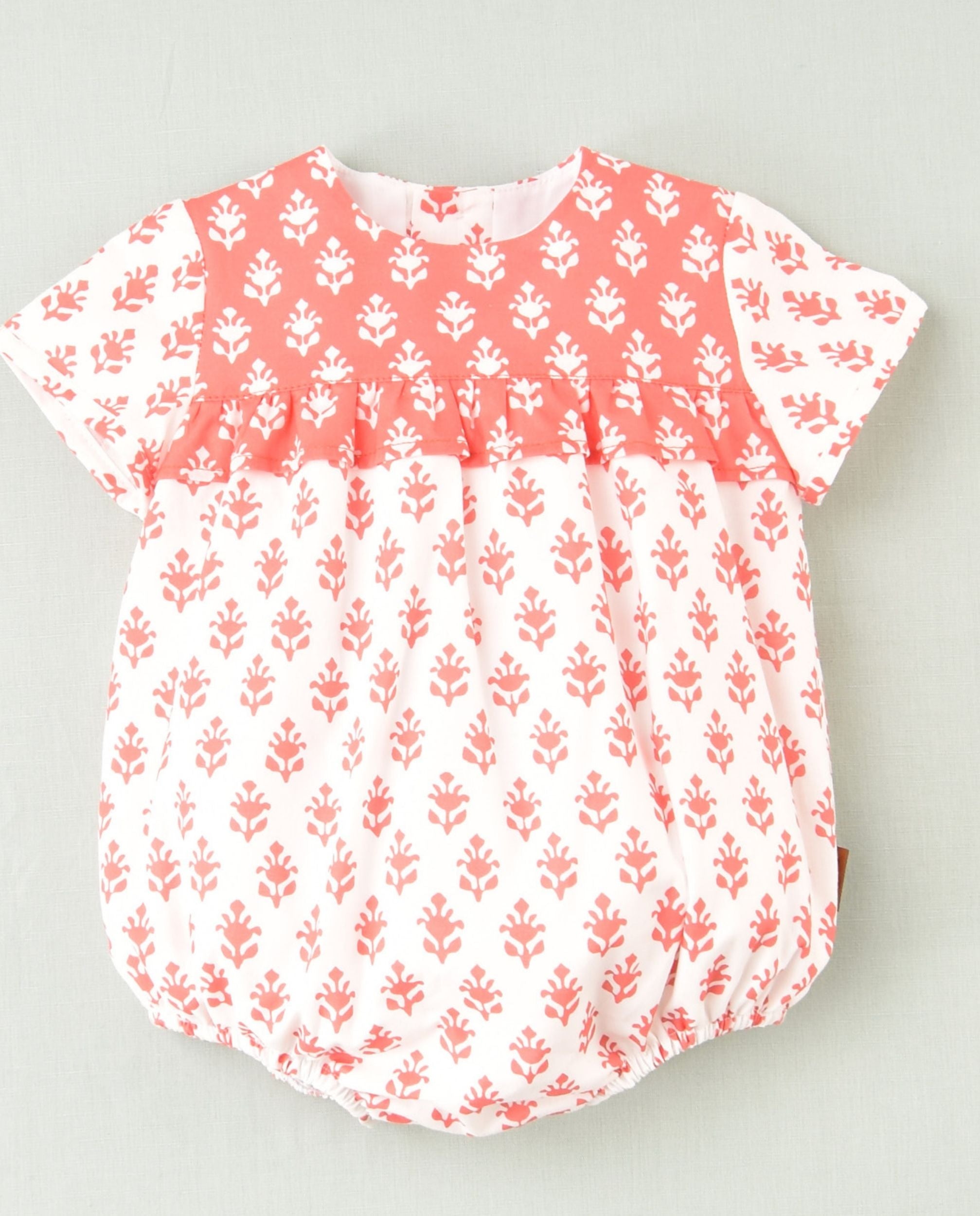 Pelele flores coral bebé niña