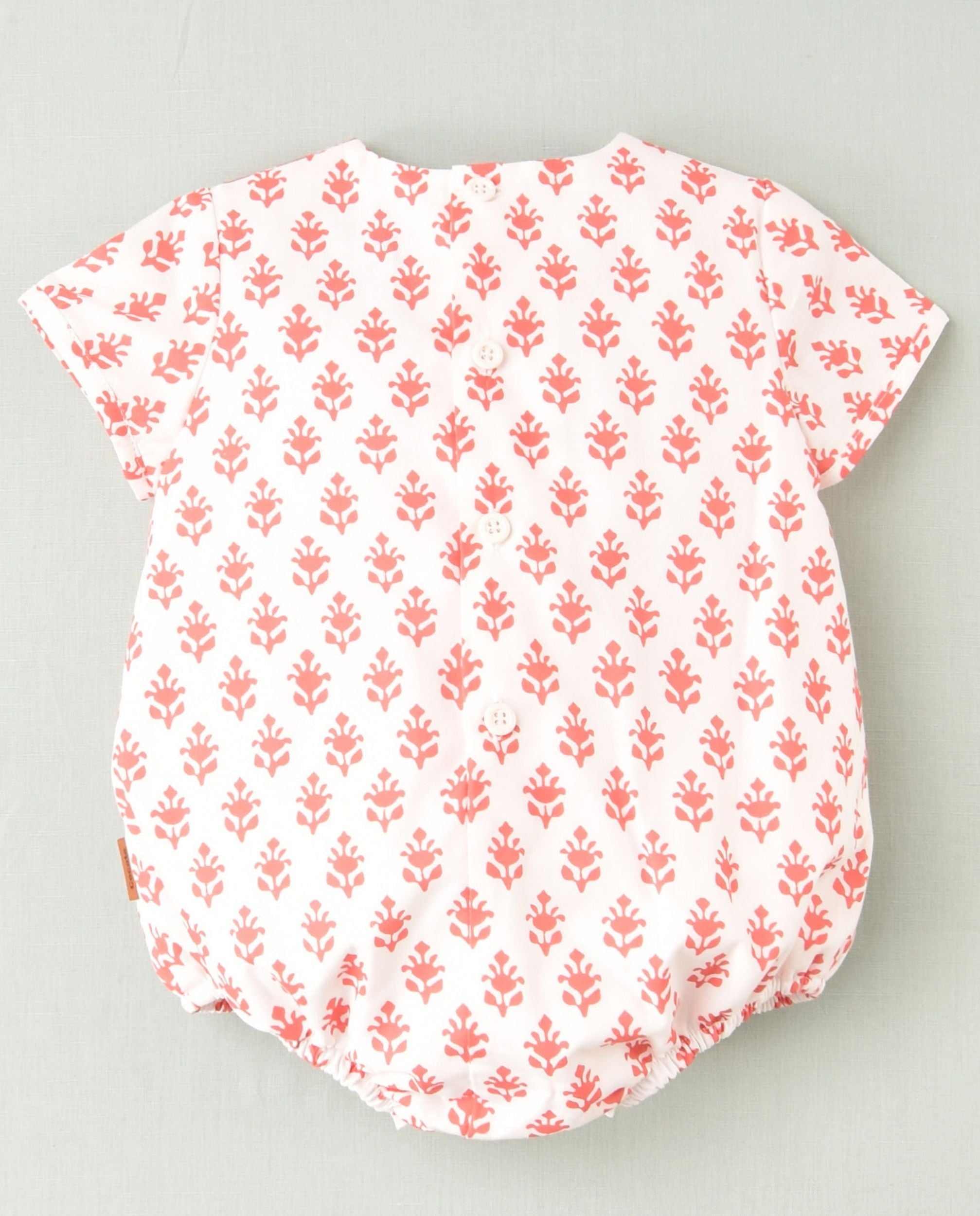 Pelele flores coral bebé niña