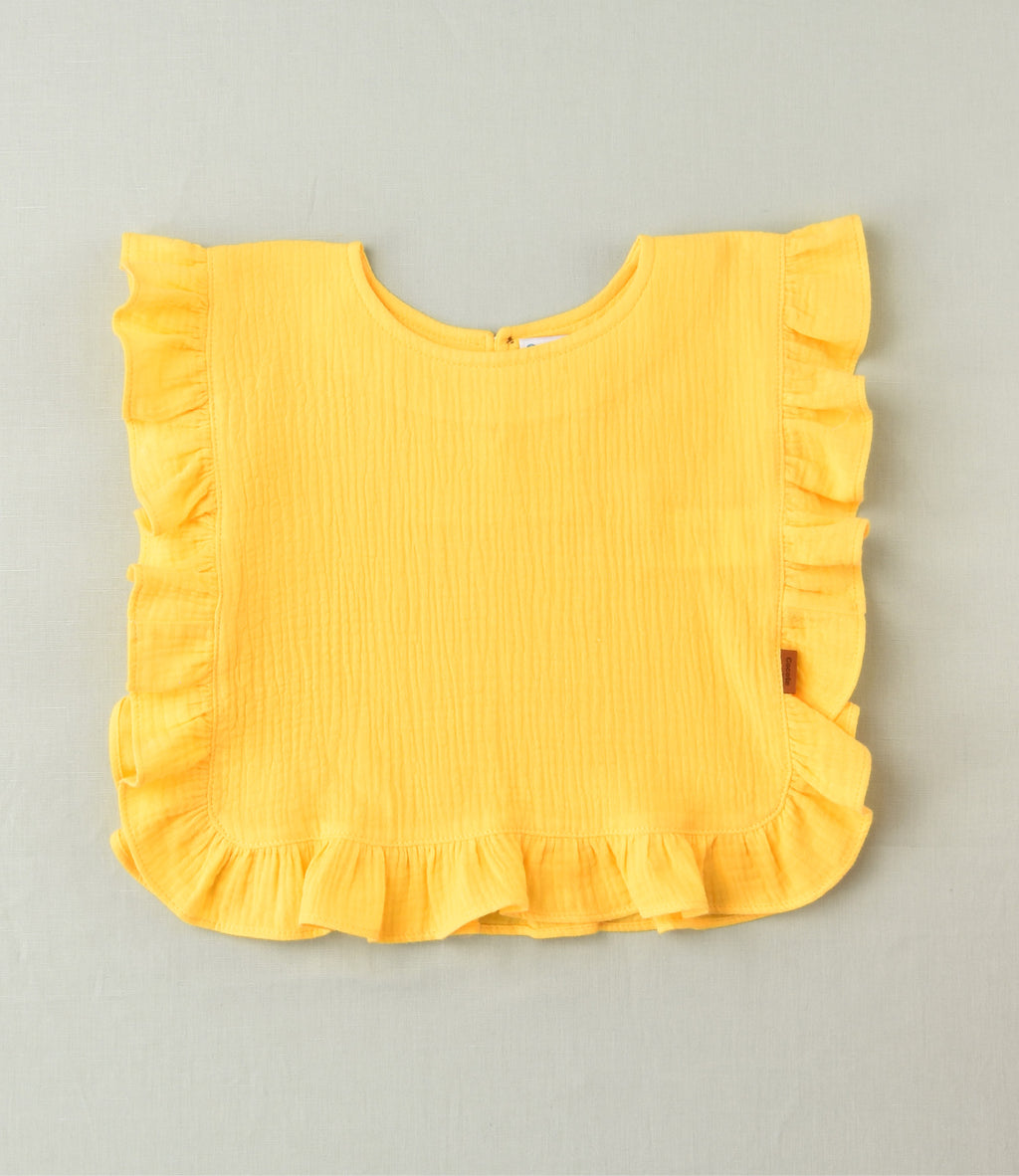 Camiseta lisa con volante amarilla niña