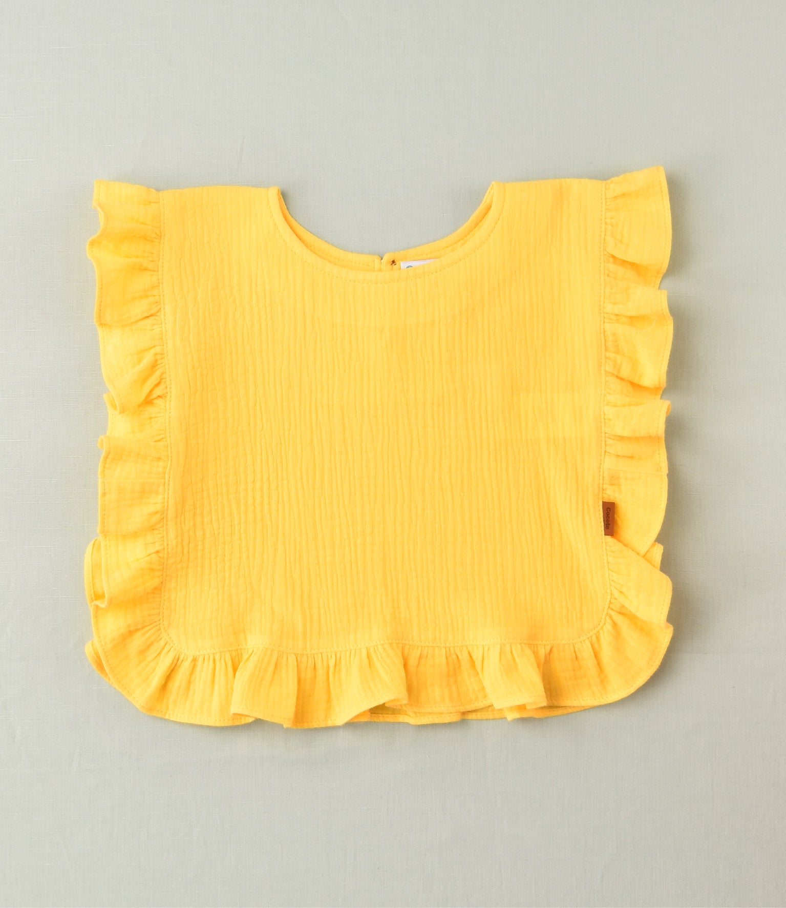 Camiseta lisa con volante amarilla niña