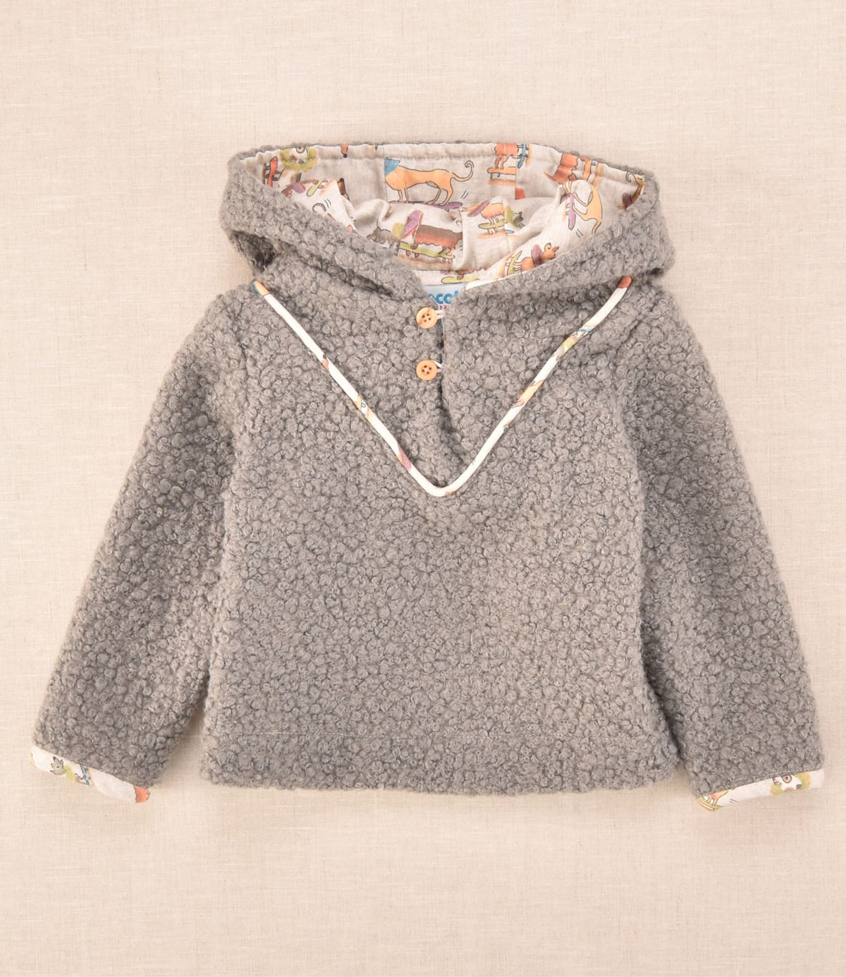 Chaqueta de bebé en tejido borreguito gris con capucha y forro estampado de perritos Cocote x Charanga