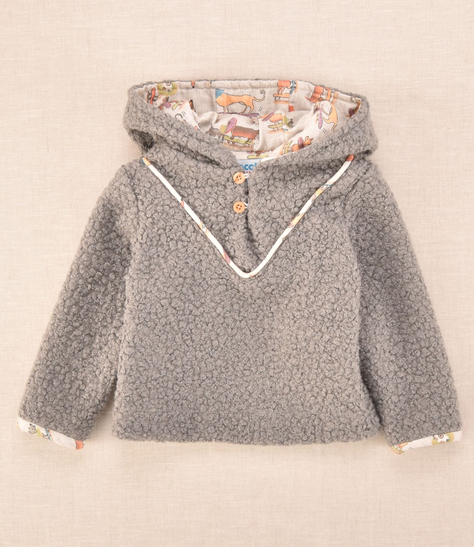 Chaqueta de bebé en tejido borreguito gris con capucha y forro estampado de perritos Cocote x Charanga