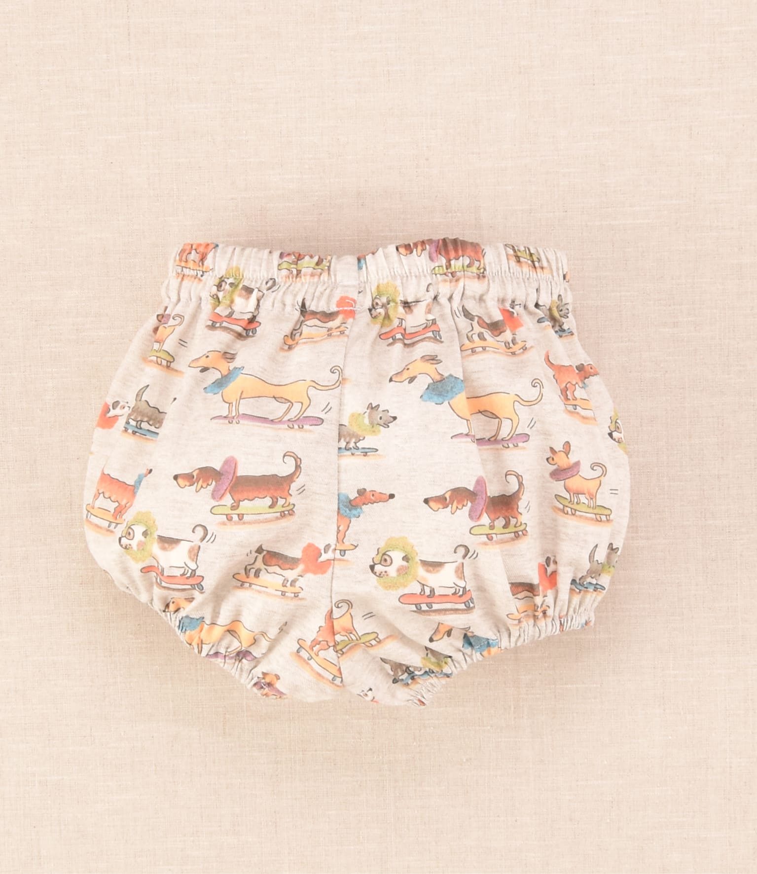 Ranita de bebé unisex con estampado de perritos sobre monopatines Cocote x Charanga