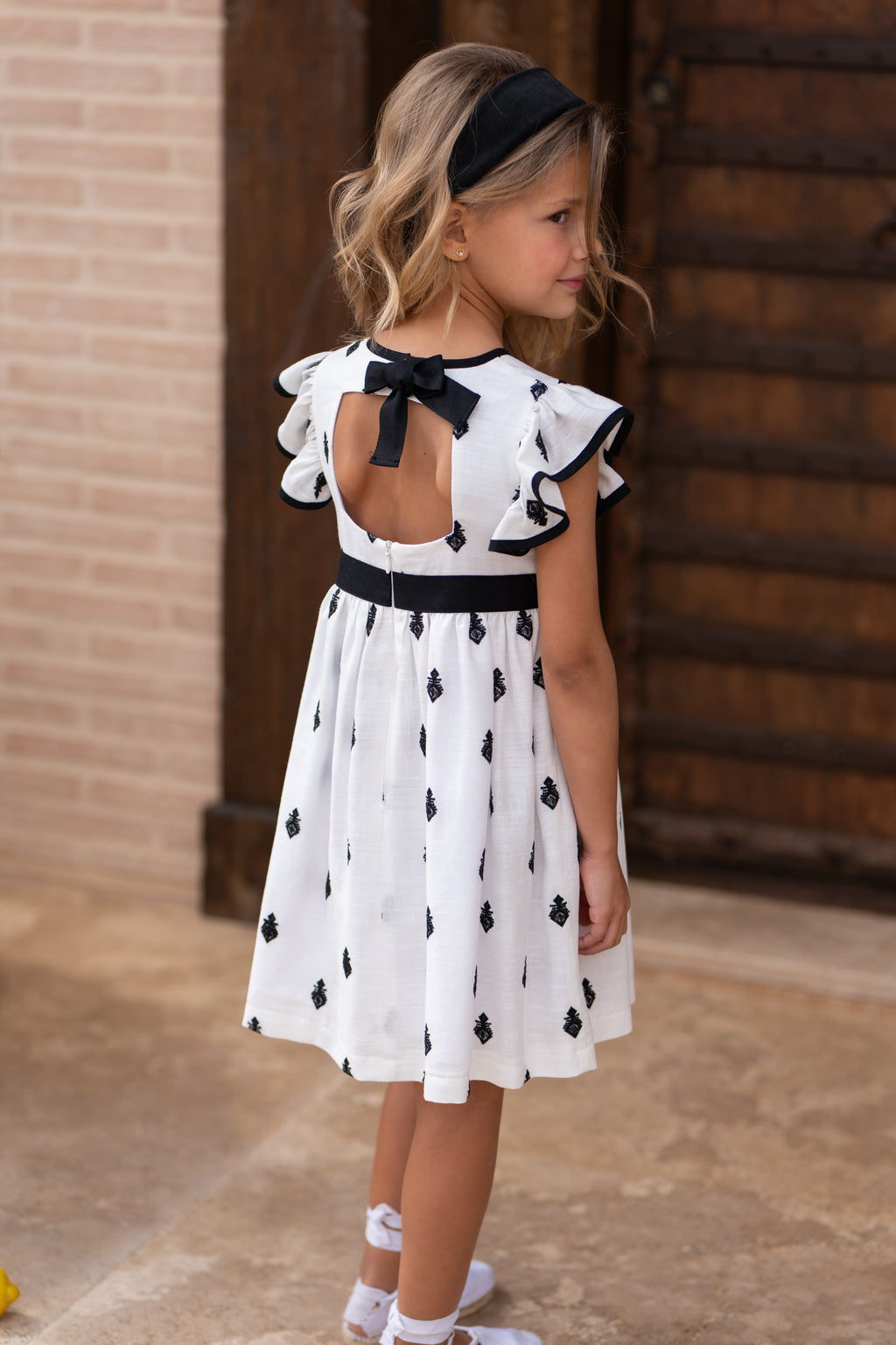 Vestido niña bordado negro con lazo | Cocote by Charanga