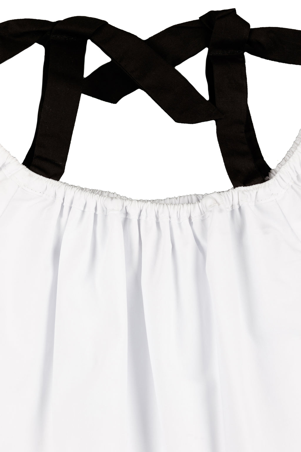 Blusa niña blanca con lazos negros