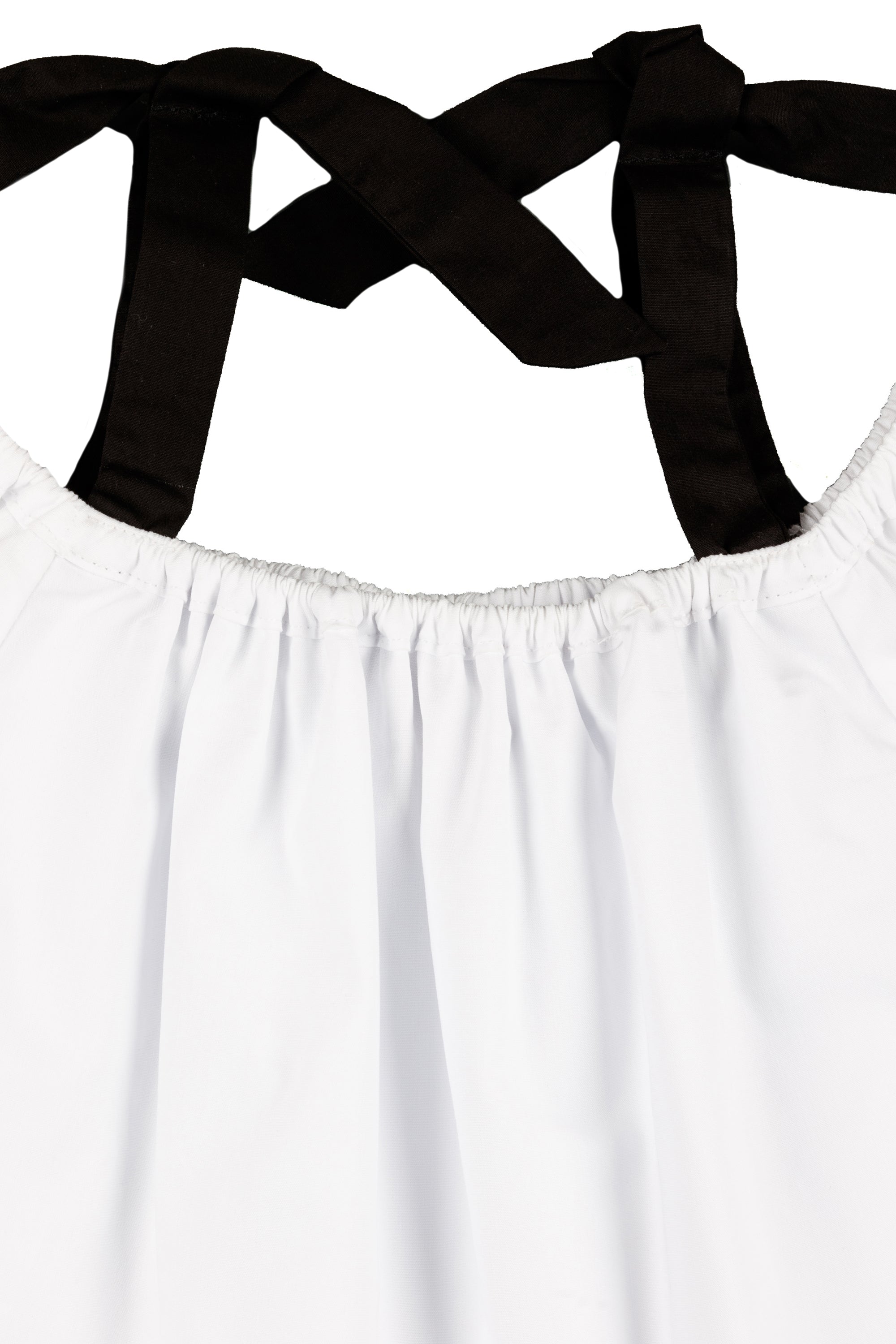 Blusa niña blanca con lazos negros