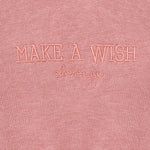 detalle tejido de felpa en sudadera rosa niña