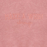 detalle tejido de felpa en sudadera rosa niña