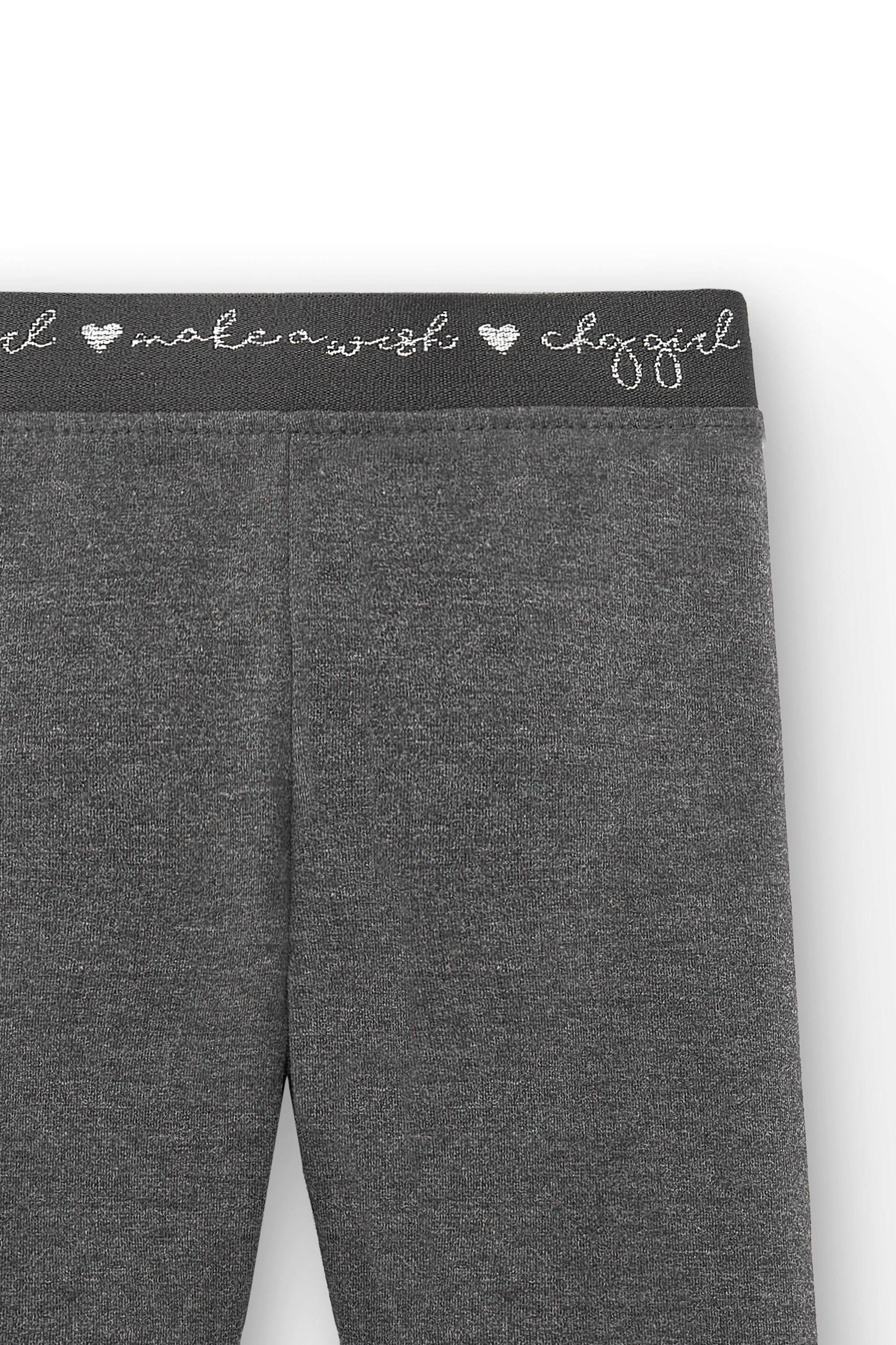 detalle pretina decorada en legging antracita niña