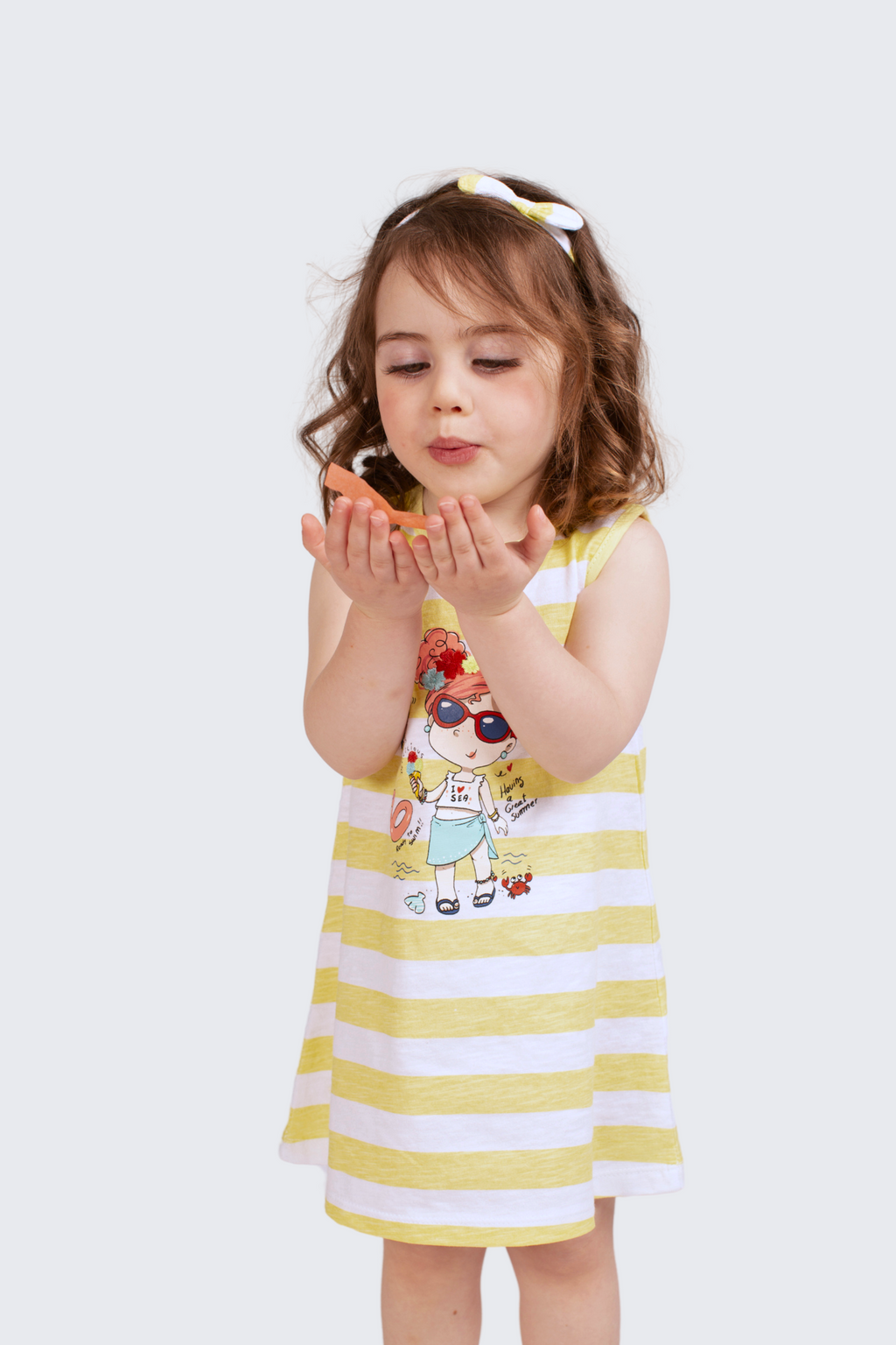 Vestido de bebé a rayas en color amarillo