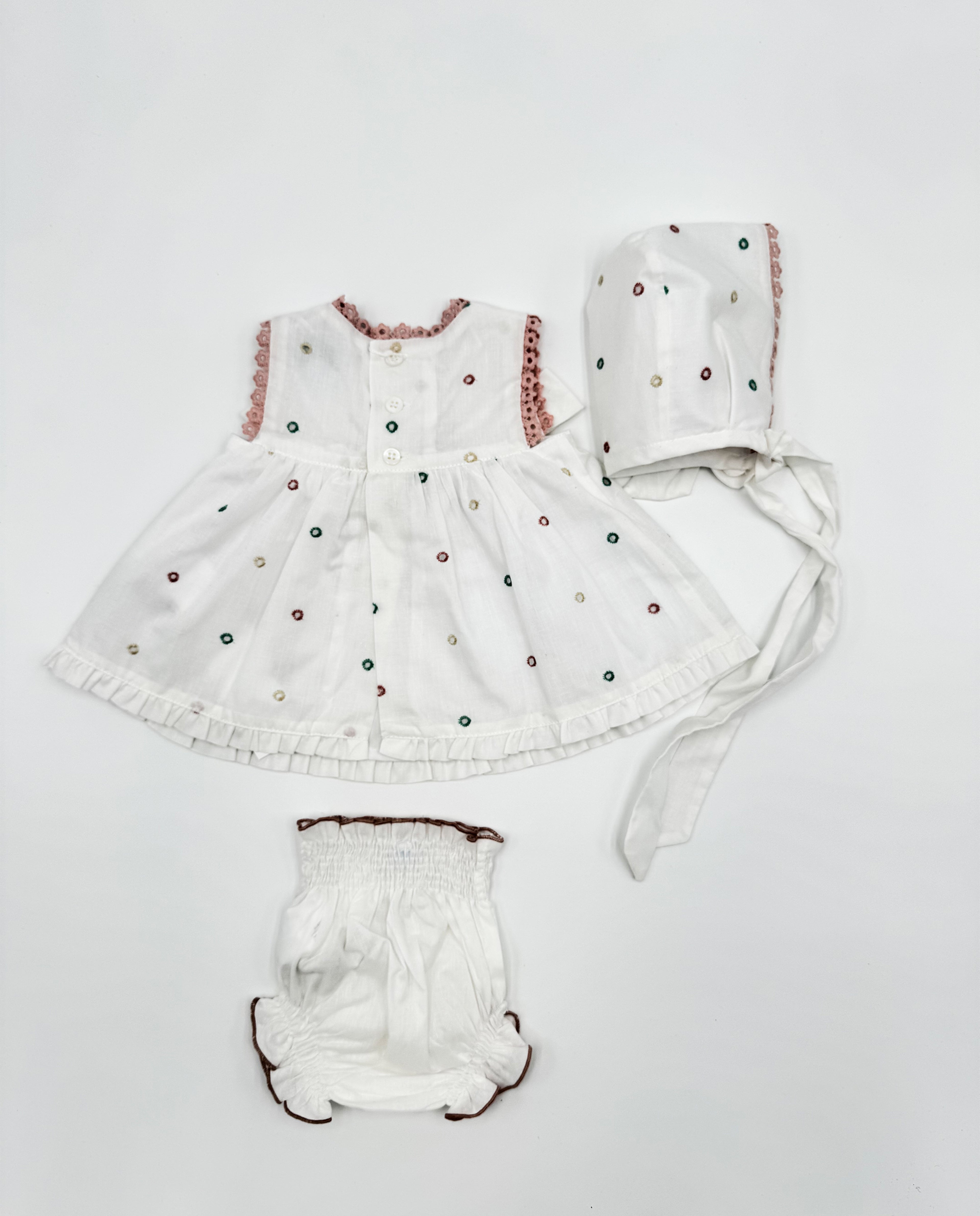 Conjunto vestido, braguita y capota perforado rosa lazos bebé | Cocote by Charanga