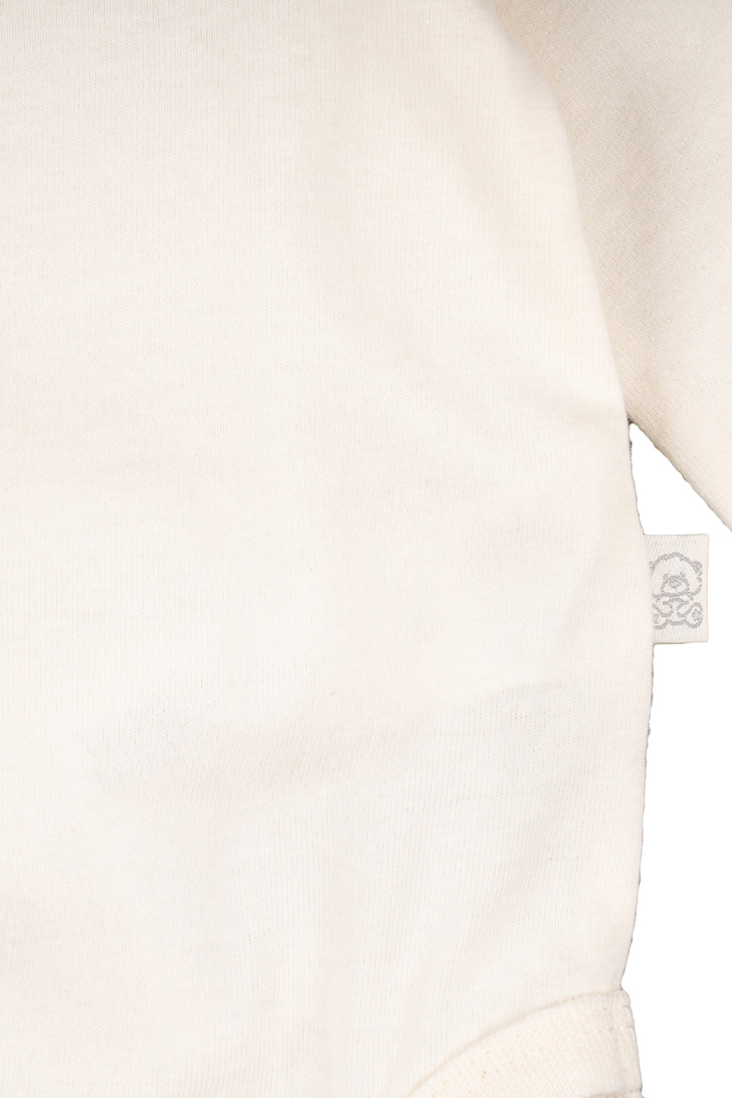 Body de recién nacido color crudo con cuello alto Outlet