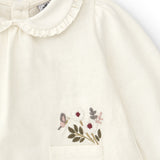Baby shirt in ecru color with flower details
