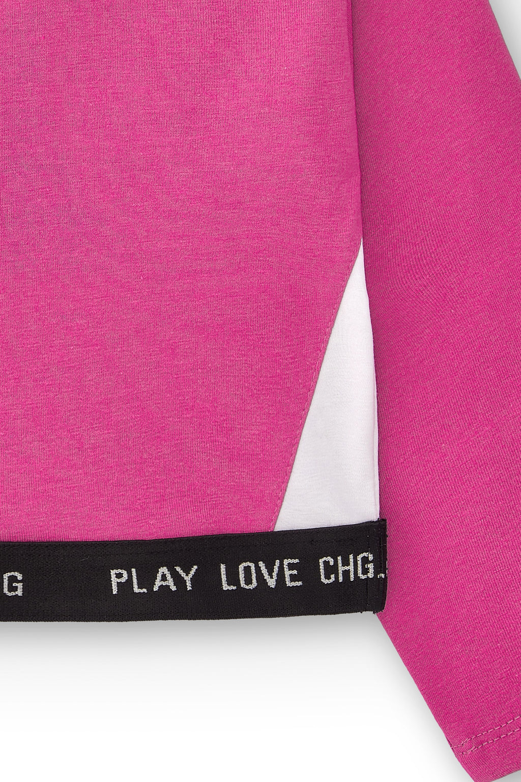 detalle banda inferior top deportivo niña fucsia