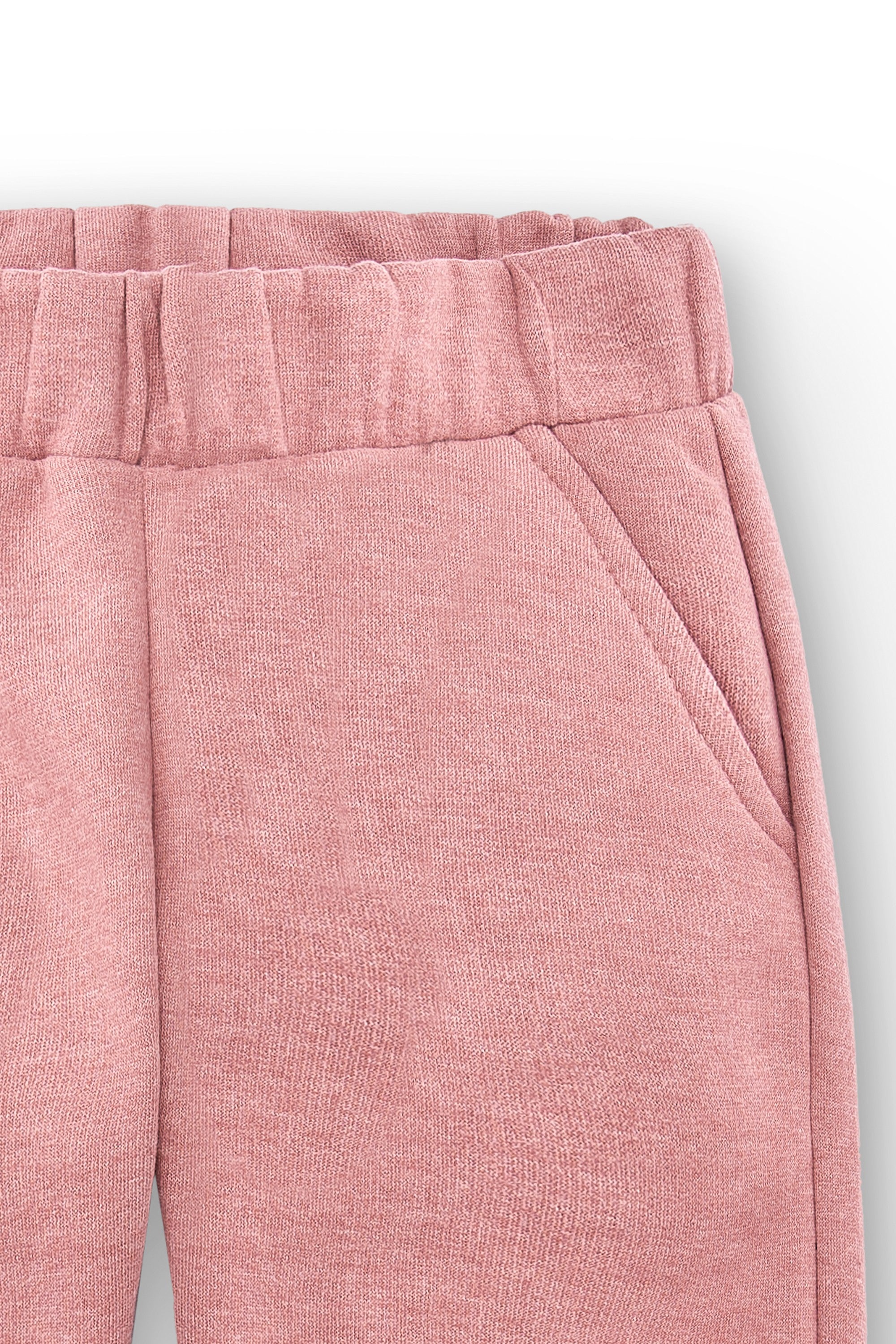 Pantalón de niña rosa y bajos con puños